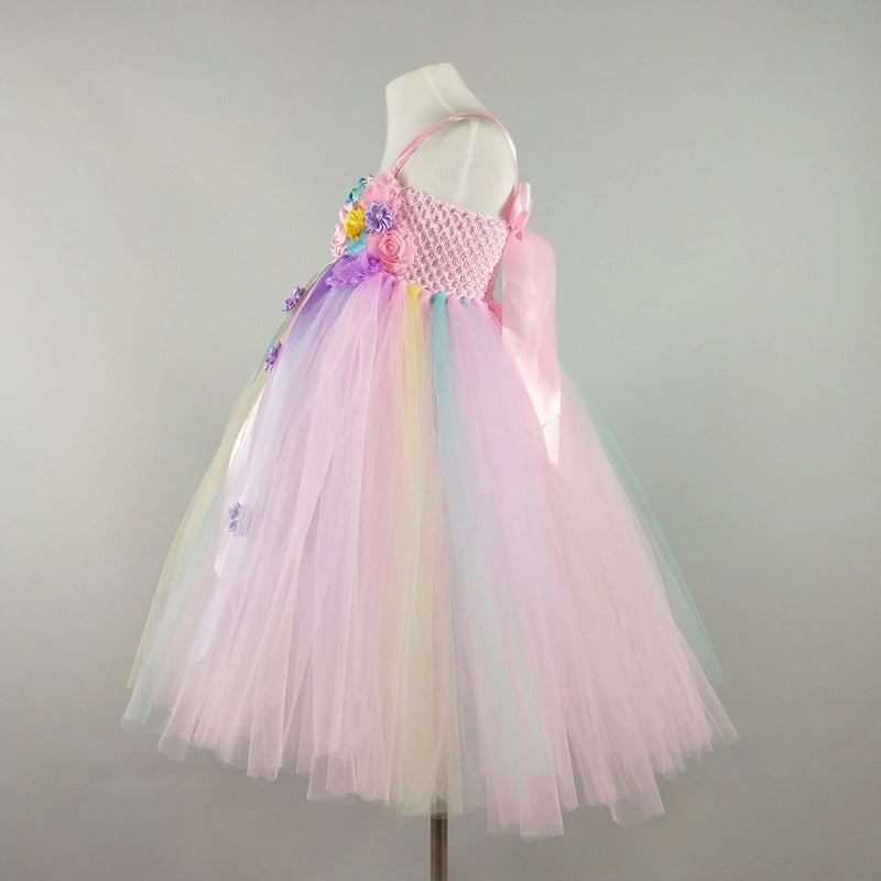 Pastel-colored tutu dress on a mannequin against a plain background