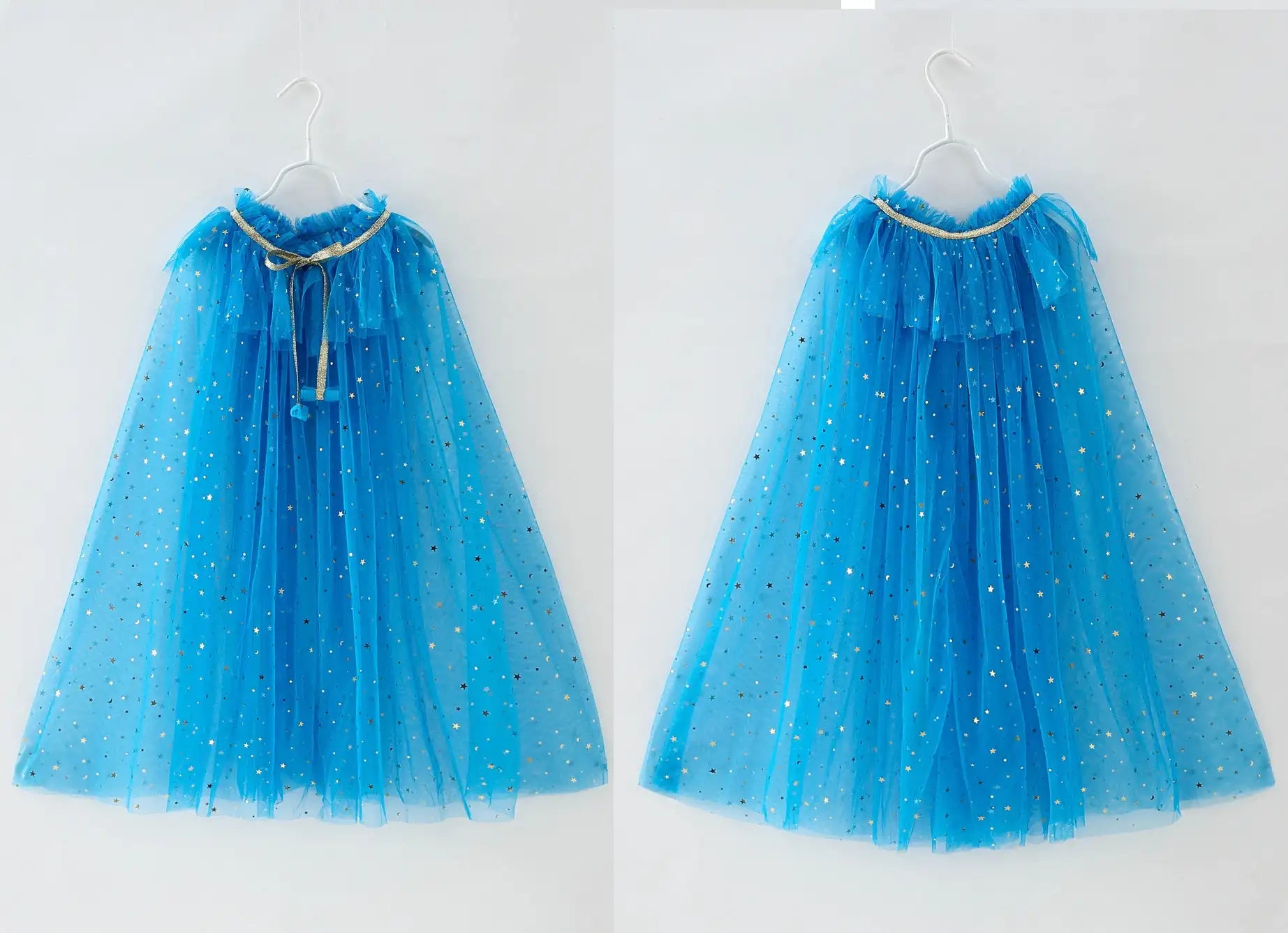Two blue tulle capes with gold trim on hangers against a white background