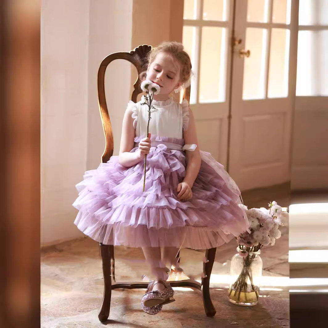 little girl in Lavender Layered Tulle Dress sitting