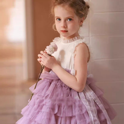 little girl in Lavender Layered Tulle Dress looking straight