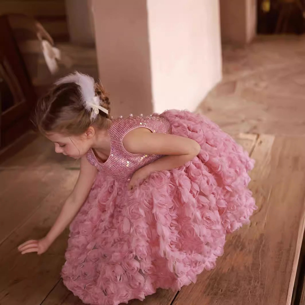 Girl in Pink Sequined Flower Dress kneeling 