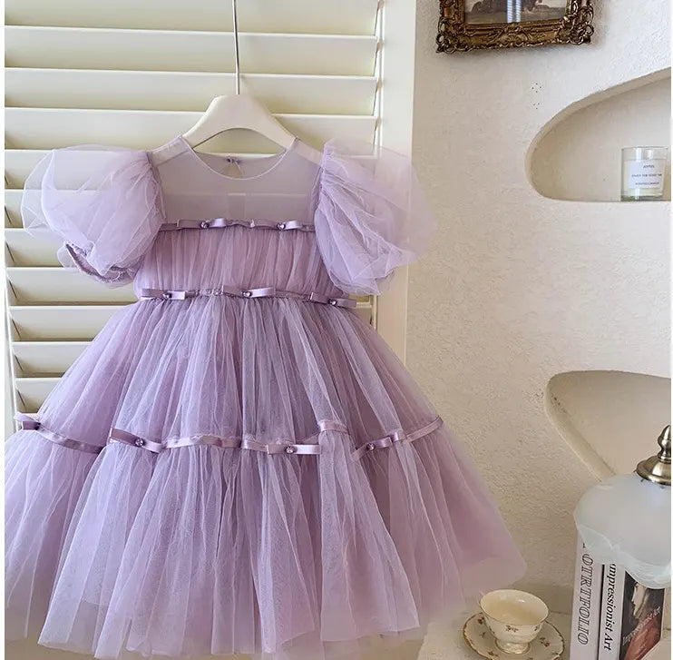 Lavender Purple Tulle Tutu Dress  on a hanger against a neutral background