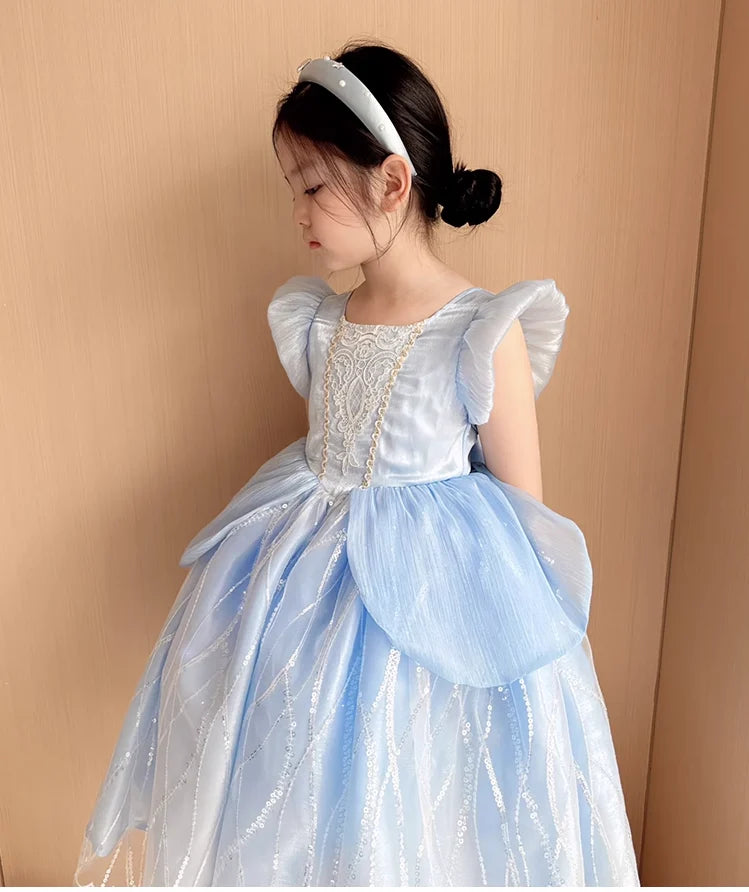 Young girl wearing a light blue Blue Fairy Princess Dress for Girls | Elegant Tulle Party Gown ground