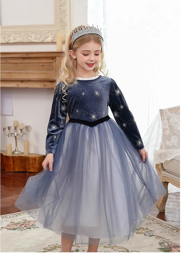 Young girl in a star-patterned  Dark Blue Long Sleeves Sparkle snow Princess Dress with a tiara indoors.