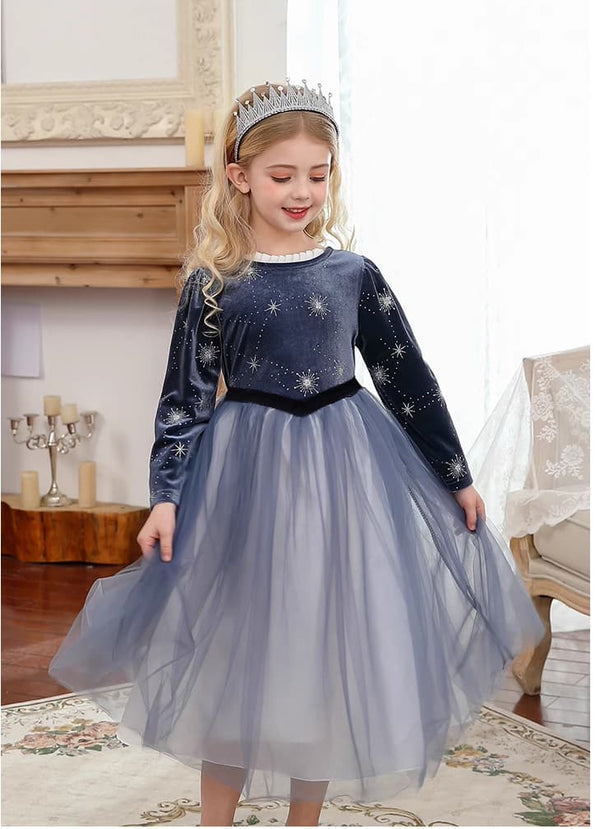 Young girl in a star-patterned  Dark Blue Long Sleeves Sparkle snow Princess Dress with a tiara indoors.