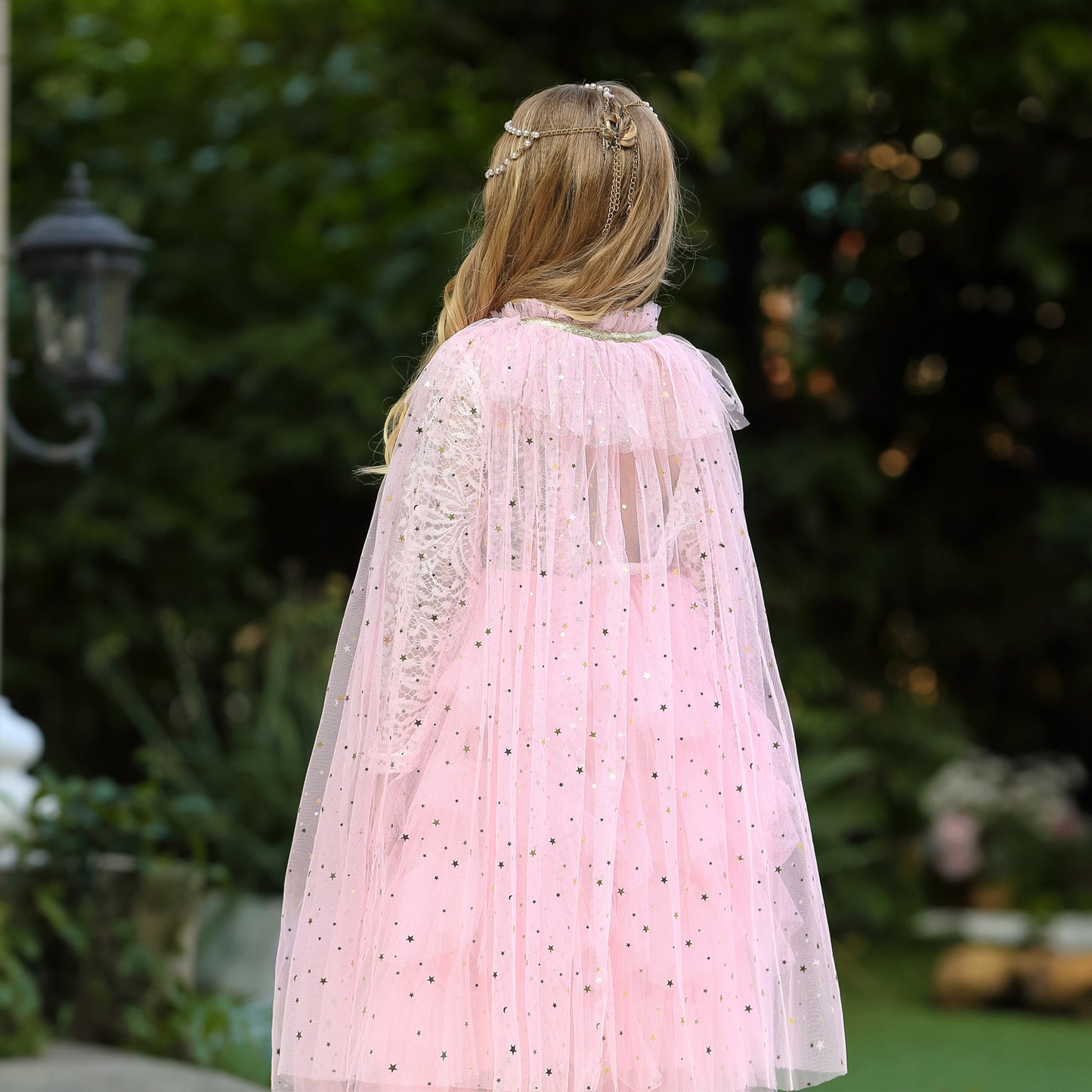 girl with pink tulle princess cape back