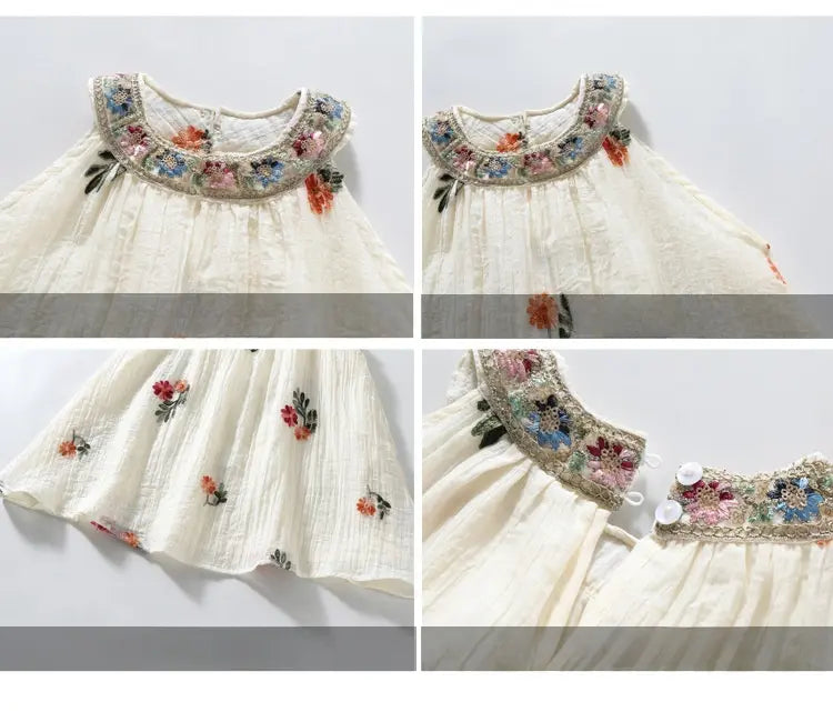 White Sleeveless summer dress  with floral embroidery on a light gray background