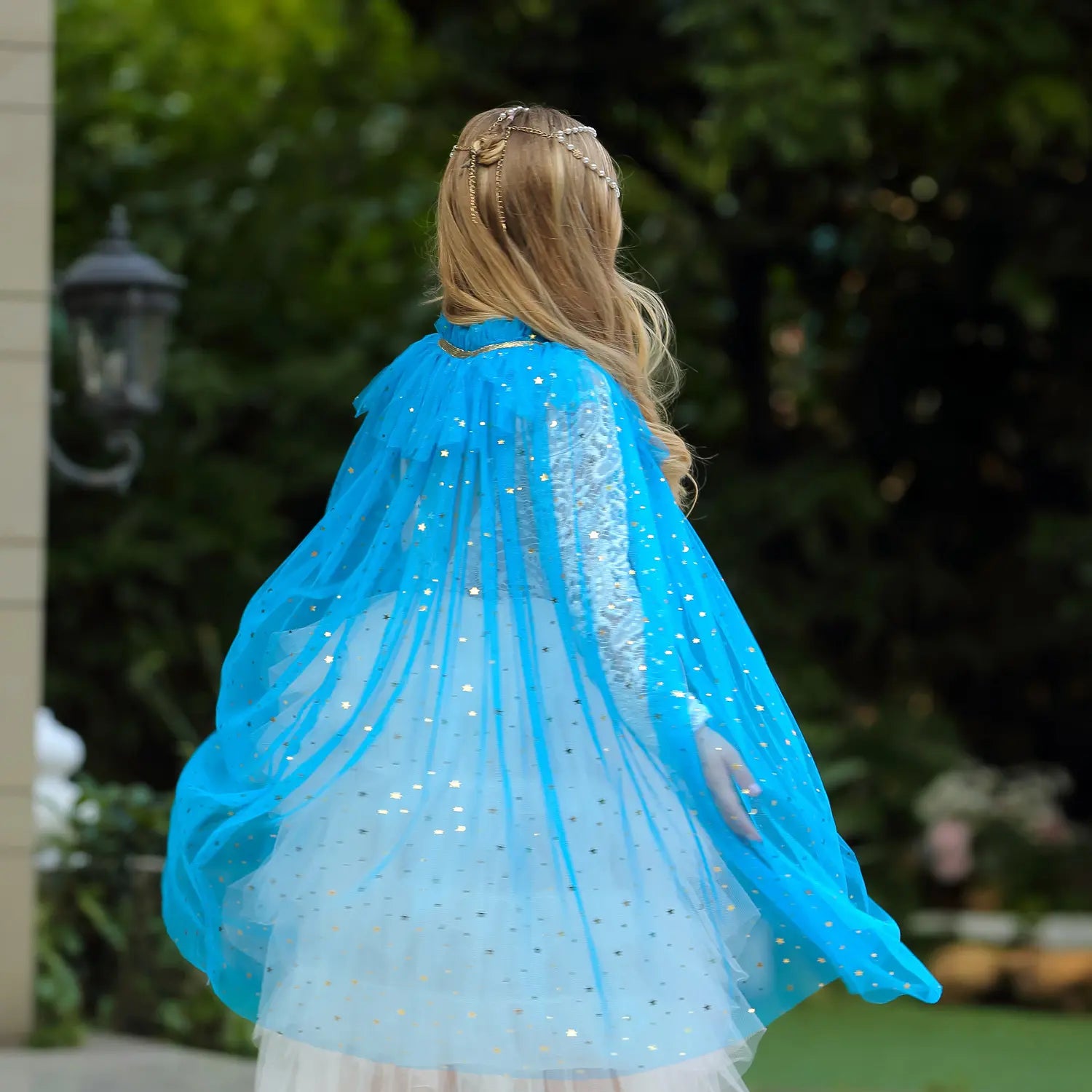 Person wearing a blue Star Tulle Fairy Dress Up Princess Cape outdoors