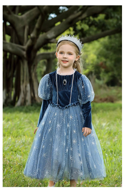 kid in Blue princess Elsa long sleeve dress standing