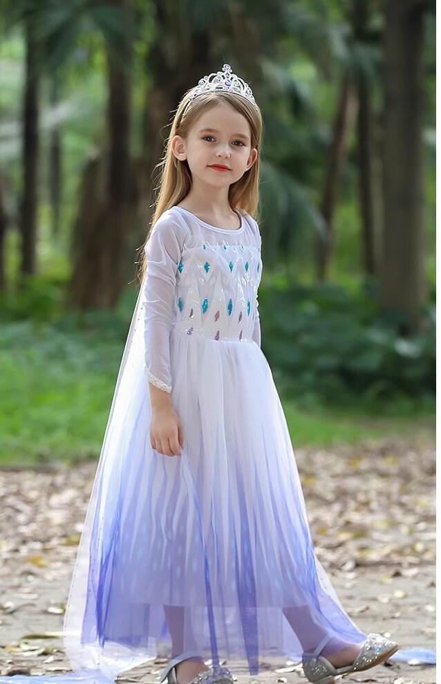 girl is Elsa dress with cape side