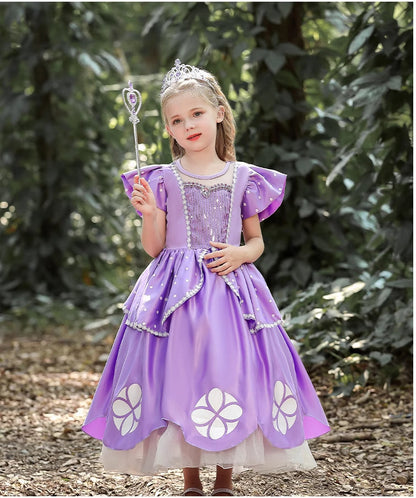 A girl dressed in an elegant purple gown with intricate floral accents and a sparkling tiara 